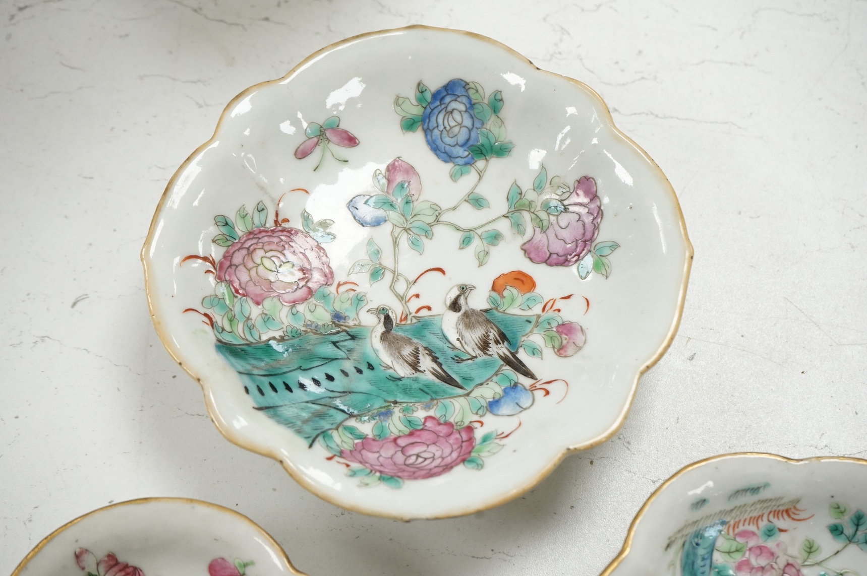 Four graduated Chinese famille rose dishes, late 19th century, largest, 16cm diameter. Condition - glazing flaws, otherwise good